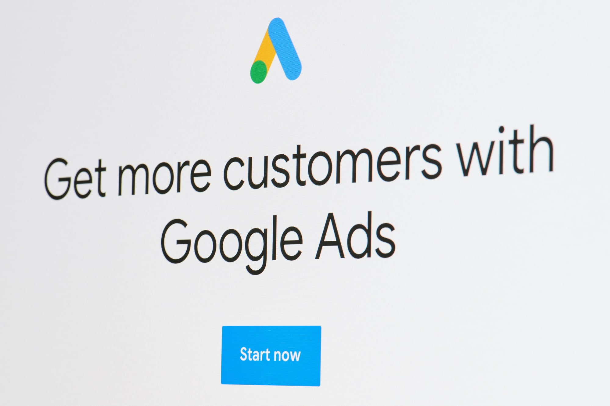 “Get more customers with Google Ads” text on a digital screen on the Google Ads setup screen before they show users the different Google Ad types.