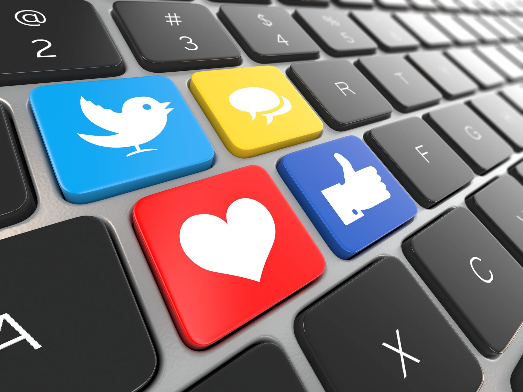 Abstract image of social media logos on keyboard.